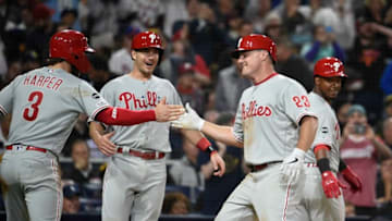 SAN DIEGO, CA - JUNE 4: Jay Bruce #23 of the Philadelphia Phillies is congratulated by Bryce Harper #3, J.T. Realmuto #10 and Jean Segura #2 after hitting a grand slam during the fifth inning of a baseball game against the San Diego Padres at Petco Park June 4, 2019 in San Diego, California. (Photo by Denis Poroy/Getty Images)