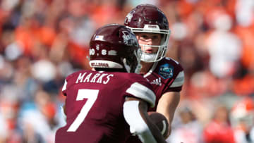 Jan 2, 2023; Tampa, FL, USA; Mississippi State Bulldogs quarterback Will Rogers (2) hands off to running back Jo'quavious Marks (7) against the Illinois Fighting Illini in the first quarter during the 2023 ReliaQuest Bowl at Raymond James Stadium. Mandatory Credit: Nathan Ray Seebeck-USA TODAY Sports