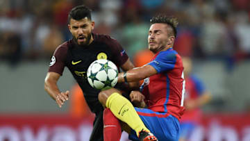 Sergio Aguero (L) of Manchester City vies with Jugurtha Hamroun of Steaua Bucharest during the UEFA Champions league first leg play-off football match between Steaua Bucharest and Manchester City at the National Arena stadium in Bucharest on August 16, 2016. / AFP / DANIEL MIHAILESCU (Photo credit should read DANIEL MIHAILESCU/AFP/Getty Images)