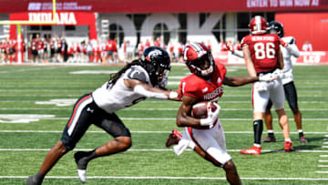 Indiana Hoosiers wide receiver D.J. Matthews runs the ball into the end zone against Cincinnati Bearcats cornerback Arquon Bush. USA Today.