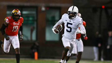 Nov 6, 2021; College Park, Maryland, USA; Penn State Nittany Lions wide receiver Jahan Dotson (5) runs a fourth quarter touchdown as Maryland Terrapins linebacker Ahmad McCullough (19) defends at Capital One Field at Maryland Stadium. Mandatory Credit: Tommy Gilligan-USA TODAY Sports