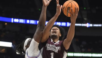 Mar 9, 2023; Nashville, TN, USA; Mississippi State Bulldogs forward Tolu Smith (1) shoots over Florida Gators center Jason Jitoboh (33) during the first half at Bridgestone Arena. Mandatory Credit: Steve Roberts-USA TODAY Sports