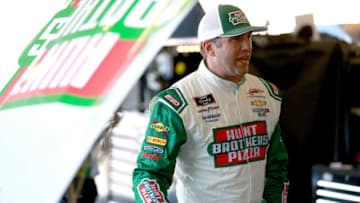PHOENIX, AZ - NOVEMBER 09: Elliott Sadler, driver of the #1 Hunt Brothers Pizza Chevrolet, stands in the garage area during practice for the NASCAR Xfinity Series Whelen Trusted To Perform 200 at ISM Raceway on November 9, 2018 in Phoenix, Arizona. (Photo by Sean Gardner/Getty Images)