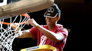 NEW YORK, NY - MARCH 26: PJ Dozier #15 of the South Carolina Gamecocks celebrates by cutting down the net after defeating the Florida Gators with a score of 77 to 70 to win the 2017 NCAA Men's Basketball Tournament East Regional at Madison Square Garden on March 26, 2017 in New York City. (Photo by Elsa/Getty Images)