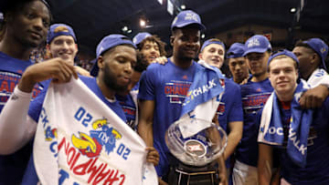 LAWRENCE, KANSAS - MARCH 04: Udoka Azubuike #35 of the Kansas Jayhawks holds the Big 12 Championship Trophy alongside teammates after defeating the TCU Horned Frogs to win the game at Allen Fieldhouse on March 04, 2020 in Lawrence, Kansas. (Photo by Jamie Squire/Getty Images)