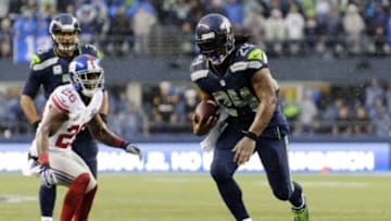 Nov 9, 2014; Seattle, WA, USA; Seattle Seahawks running back Marshawn Lynch (24) carries the ball against the New York Giants during the second half at CenturyLink Field. Seattle defeated New York 38-17. Mandatory Credit: Steven Bisig-USA TODAY Sports