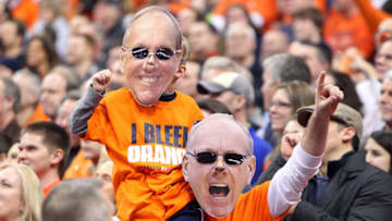 SYRACUSE, NY - JANUARY 21: Fans of the Syracuse Orange cheer with masks of head coach Jim Boeheim (not pictured) over their faces during the game against the Cincinnati Bearcats at the Carrier Dome on January 21, 2013 in Syracuse, New York. (Photo by Nate Shron/Getty Images)