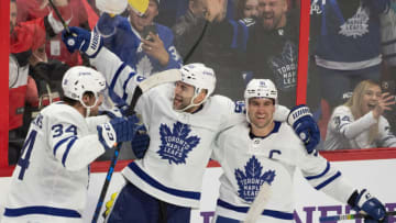 Apr 16, 2022; Ottawa, Ontario, CAN; Toronto Maple Leafs defenseman Mark Giordano (55) celebrates with center Auston Matthews (34) and center John Tavares (91) their win against the Ottawa Senators at the Canadian Tire Centre. Mandatory Credit: Marc DesRosiers-USA TODAY Sports
