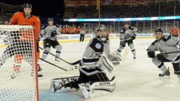 Jan 25, 2014; Los Angeles, CA, USA; Los Angeles Kings goalie Jonathan Quick (32) watches the puck during the Stadium Series hockey game against the Anaheim Ducks at Dodger Stadium. Mandatory Credit: Jayne Kamin-Oncea-USA TODAY Sports