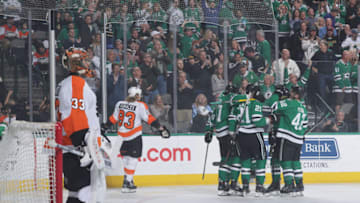 DALLAS, TX - APRIL 2: Ben Lovejoy #21, Taylor Fedun #42 and the Dallas Stars celebrate a goal against the Philadelphia Flyers at the American Airlines Center on April 2, 2019 in Dallas, Texas. (Photo by Glenn James/NHLI via Getty Images)