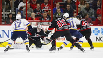 Feb 28, 2016; Raleigh, NC, USA; Carolina Hurricanes goalie Cam Ward (30) stops the second period shot by St. Louis Blues forward Vladimir Tarasenko (91) at PNC Arena. Mandatory Credit: James Guillory-USA TODAY Sports