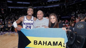 SACRAMENTO, CA - MARCH 23: Buddy Hield #24 of the Sacramento Kings poses with fans from Bahama after the game against the Phoenix Suns on March 23, 2019 at Golden 1 Center in Sacramento, California. NOTE TO USER: User expressly acknowledges and agrees that, by downloading and or using this photograph, User is consenting to the terms and conditions of the Getty Images Agreement. Mandatory Copyright Notice: Copyright 2019 NBAE (Photo by Rocky Widner/NBAE via Getty Images)