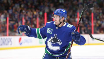 VANCOUVER, BC - OCTOBER 09: Quinn Hughes #4 of the Vancouver Canucks celebrates his first NHL goal against the Los Angeles Kings at Rogers Arena on October 9, 2019 in Vancouver, Canada. (Photo by Ben Nelms/Getty Images)