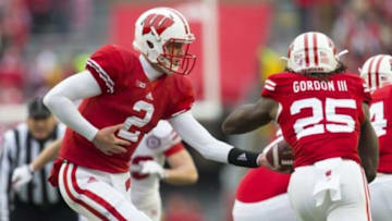 Nov 15, 2014; Madison, WI, USA; Wisconsin Badgers quarterback Joel Stave (2) hands the football off to running back Melvin Gordon (25) during the first quarter against the Nebraska Cornhuskers at Camp Randall Stadium. Mandatory Credit: Jeff Hanisch-USA TODAY Sports