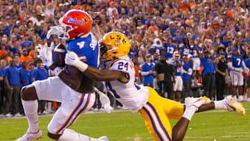 Florida Gators wide receiver Justin Shorter (4) hauls in the first touchdown in the first half LSU Tigers cornerback Jarrick Bernard-Converse (24) tries to defend it at Steve Spurrier Field at Ben Hill Griffin Stadium in Gainesville, FL on Saturday, October 15, 2022. [Doug Engle/Gainesville Sun]Ncaa Football Florida Gators Vs Lsu Tigers