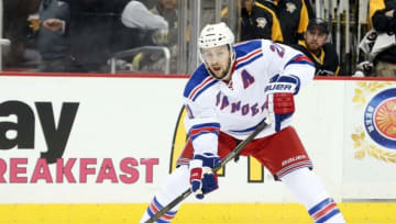 Apr 23, 2016; Pittsburgh, PA, USA; New York Rangers center Derek Stepan (21) moves the puck against the Pittsburgh Penguins during the third period in game five of the first round of the 2016 Stanley Cup Playoffs at the CONSOL Energy Center. The Pens won 6-3. Mandatory Credit: Charles LeClaire-USA TODAY Sports