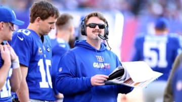 Dec 6, 2015; East Rutherford, NJ, USA; New York Giants quarterback Eli Manning (10) and offensive coordinator Ben McAdoo look at the playbook during the second quarter against the New York Jets at MetLife Stadium. Mandatory Credit: Brad Penner-USA TODAY Sports