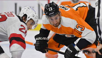 Dec 14, 2021; Philadelphia, Pennsylvania, USA; New Jersey Devils center Michael McLeod (20) and Philadelphia Flyers center Kevin Hayes (13) face-off at Wells Fargo Center. Mandatory Credit: Eric Hartline-USA TODAY Sports