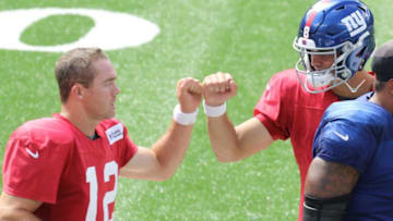 Colt McCoy is greeted by Daniel Jones on the sideline after McCoy led the offense to a TD during an afternoon scrimmage at MetLife Stadium on September 3, 2020.The New York Giants Hold An Afternoon Scrimmage At Metlife Stadium On September 3 2020