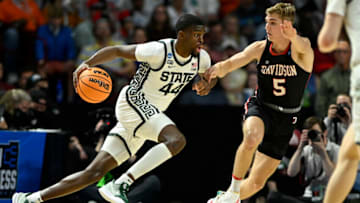 GREENVILLE, SOUTH CAROLINA - MARCH 18: Gabe Brown #44 of the Michigan State Spartans dribbles against Grant Huffman #5 of the Davidson Wildcats during the first half in the first round game of the 2022 NCAA Men's Basketball Tournament at Bon Secours Wellness Arena on March 18, 2022 in Greenville, South Carolina. (Photo by Eakin Howard/Getty Images)