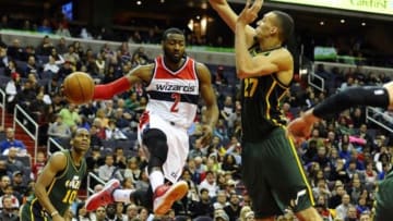 Dec 14, 2014; Washington, DC, USA; Washington Wizards guard John Wall (2) passes the ball as Utah Jazz center Rudy Gobert (27) defends during the second half at Verizon Center. The Wizards won 93-84. Mandatory Credit: Brad Mills-USA TODAY Sports
