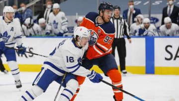 Toronto Maple Leafs forward Mitch Marner (16) and Edmonton Oilers forward Connor McDavid (97) battle for position. (Perry Nelson-USA TODAY Sports)