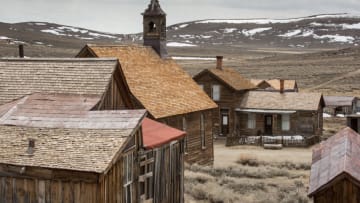 BRIDGEPORT, CA - APRIL 16: Abandoned buildings maintained with a degree of "arrested decay" are all that remain in this ghost town located in the isolated hills east of the Sierra Nevada mountain range as viewed on April 16, 2021, near Bridgeport, California. Bodie State Historic Park is a genuine California gold-mining ghost town where visitors can walk down the deserted streets of a town that once had a population of nearly 10,000 people. (Photo by George Rose/Getty Images)