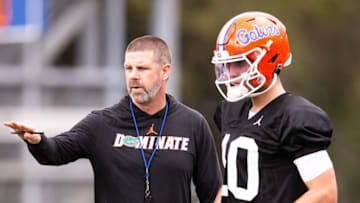 Florida Gators head coach Billy Napier talks with Florida Gators quarterback Jack Miller III (10) during passing drills. The University of Florida held their first day of the 2023 Football Spring Practice Saturday March 4, 2023.[Doug Engle/Gainesville Sun]2023Gai Uffootballspring