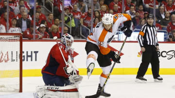 Apr 14, 2016; Washington, DC, USA; Washington Capitals goalie Braden Holtby (70) makes a save behind Philadelphia Flyers center Ryan White (25) in the second period in game one of the first round of the 2016 Stanley Cup Playoffs at Verizon Center. Mandatory Credit: Geoff Burke-USA TODAY Sports