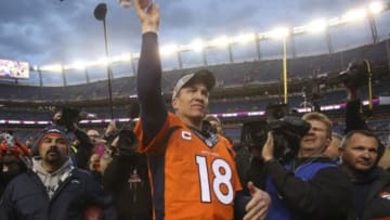 Jan 24, 2016; Denver, CO, USA; Denver Broncos quarterback Peyton Manning (18) throws his towel to fans after the AFC Championship football game at Sports Authority Field at Mile High. Denver Broncos defeated New England Patriots 20-18 to earn a trip to Super Bowl 50. Mandatory Credit: Chris Humphreys-USA TODAY Sports