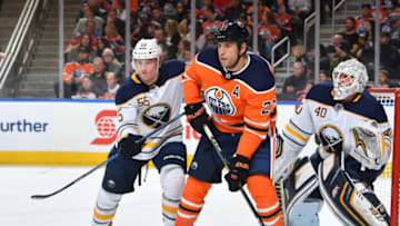 EDMONTON, AB - JANUARY 23: Milan Lucic #27 of the Edmonton Oilers battles for position against Rasmus Ristolainen #55 and Robin Lehner #40 the Buffalo Sabres on January 23, 2017 at Rogers Place in Edmonton, Alberta, Canada. (Photo by Andy Devlin/NHLI via Getty Images)