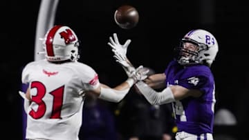 Elder Panthers wide receiver Justin Re catches a pass against the Milford Eagles. The Enquirer.