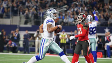Dec 18, 2016; Arlington, TX, USA; Dallas Cowboys quarterback Dak Prescott (4) runs for a second quarter touchdown against the Tampa Bay Buccaneers at AT&T Stadium. Mandatory Credit: Matthew Emmons-USA TODAY Sports