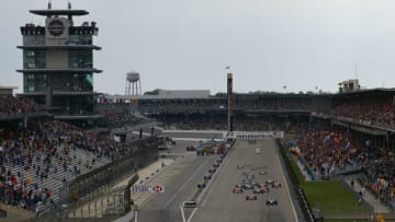 INDIANAPOLIS, IN - SEPTEMBER 28: The race starts as Kimi Raikonnen of Finland and McLaren leads into the first corner during the Formula One United States Grand Prix, September 28, 2003 in Indianapolis, Indiana. (Photo by Clive Mason/Getty Images)