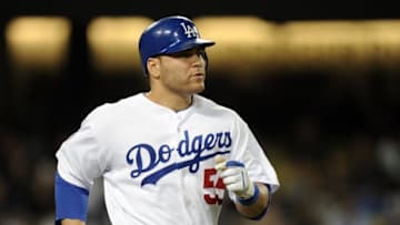 LOS ANGELES, CA - MAY 20: Russell Martin #55 of the Los Angeles Dodgers makes his way to first base against the San Diego Padres at Dodger Stadium on May 20, 2010 in Los Angeles, California. (Photo by Harry How/Getty Images)