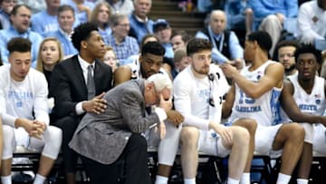 CHAPEL HILL, NORTH CAROLINA - JANUARY 12: Head coach Roy Williams of the North Carolina Tar Heels goes to his knees during the second half of their game against the Louisville Cardinals at the Dean Smith Center on January 12, 2019 in Chapel Hill, North Carolina. Louisville won 83-62. (Photo by Grant Halverson/Getty Images)
