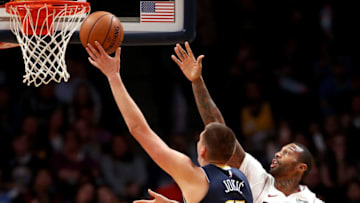DENVER, CO - NOVEMBER 03: Nikola Jokic #15 of the Denver Nuggets puts up a shot against James Johnson #16 of the Miami Heat at the Pepsi Center on November 3, 2017 in Denver, Colorado. NOTE TO USER: User expressly acknowledges and agrees that, by downloading and or using this photograph, User is consenting to the terms and conditions of the Getty Images License Agreement. (Photo by Matthew Stockman/Getty Images)