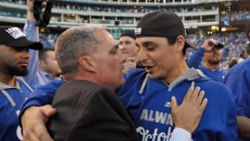 Dayton Moore embracing Jason Vargas - Mandatory Credit: Denny Medley-USA TODAY Sports