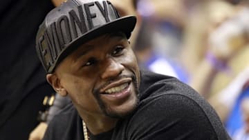 Oct 30, 2015; Orlando, FL, USA; American professional boxer Floyd Mayweather Jr. watches the Oklahoma City Thunder and Orlando Magic during the second quarter at Amway Center. Mandatory Credit: Kim Klement-USA TODAY Sports