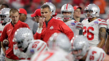 GLENDALE, AZ - DECEMBER 31: Head coach Urban Meyer of the Ohio State Buckeyes watches warm ups prior to the start of the 2016 PlayStation Fiesta Bowl against the Clemson Tigers at University of Phoenix Stadium on December 31, 2016 in Glendale, Arizona. (Photo by Jamie Squire/Getty Images)