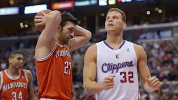 Mar 24, 2014; Los Angeles, CA, USA; Los Angeles Clippers forward Blake Griffin (32) celebrates after a basket as Milwaukee Bucks center Zaza Pachulia (27) reacts at Staples Center. The Clippers defeated the Bucks 106-98. Mandatory Credit: Kirby Lee-USA TODAY Sports