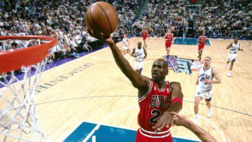 SALT LAKE CITY - JUNE 11: Michael Jordan #23 of the Chicago Bulls attempts a layup against the Utah Jazz during Game five of the 1997 NBA Finals at the Delta Center on June 11, 1997 in Salt Lake City, Utah. NOTE TO USER: User expressly acknowledges and agrees that, by downloading and/or using this Photograph, User is consenting to the terms and conditions of the Getty Images License Agreement. Mandatory Copyright Notice: Copyright 1996 NBAE (Photo by Nathaniel S. Butler/NBAE via Getty Images)