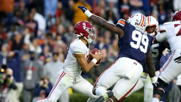 Auburn footballNov 27, 2021; Auburn, Alabama, USA; Auburn Tigers defensive lineman T.D. Moultry (99) pressures Alabama Crimson Tide quarterback Bryce Young (9) at Jordan-Hare Stadium. Alabama defeated Auburn in four overtimes. Mandatory Credit: Gary Cosby Jr.-USA TODAY Sports