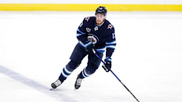 May 8, 2021; Winnipeg, Manitoba, CAN; Winnipeg Jets left wing Pierre-Luc Dubois (13) skates up the ice in the third period against the Ottawa Senators at Bell MTS Place. Mandatory Credit: James Carey Lauder-USA TODAY Sports