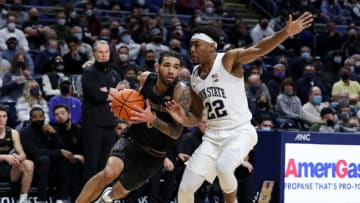 Feb 25, 2022; University Park, Pennsylvania, USA; Northwestern Wildcats guard Boo Buie (0) dribbles the ball around the outside of Penn State Nittany Lions guard Jalen Pickett (22) during the second half at Bryce Jordan Center. Penn State defeated Northwestern 67-60. Mandatory Credit: Matthew OHaren-USA TODAY Sports
