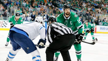DALLAS, TX - OCTOBER 06: Dallas Stars left wing Jamie Benn (14) talks to his teammate as Winnipeg Jets center Adam Lowry (17) waits for the puck to drop during the game between the Dallas Stars and the Winnipeg Jets on October 6, 2018 at the American Airlines Center in Dallas, Texas. Dallas defeats Winnipeg 5-1. (Photo by Matthew Pearce/Icon Sportswire via Getty Images)