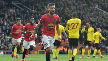 Manchester United's Portuguese midfielder Bruno Fernandes (C) celebrates scoring the opening goal from the penalty spot during the English Premier League football match between Manchester United and Watford at Old Trafford in Manchester, north west England, on February 23, 2020. (Photo by Paul ELLIS / AFP) / RESTRICTED TO EDITORIAL USE. No use with unauthorized audio, video, data, fixture lists, club/league logos or 'live' services. Online in-match use limited to 120 images. An additional 40 images may be used in extra time. No video emulation. Social media in-match use limited to 120 images. An additional 40 images may be used in extra time. No use in betting publications, games or single club/league/player publications. / (Photo by PAUL ELLIS/AFP via Getty Images)