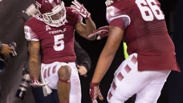 Nov 28, 2015; Philadelphia, PA, USA; Temple Owls running back Jahad Thomas (5) and offensive lineman Dion Dawkins (66) celebrate after a 60 yard touchdown run during the second half against the Connecticut Huskies at Lincoln Financial Field. Temple won 27-3. Mandatory Credit: Bill Streicher-USA TODAY Sports
