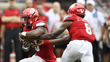 Sep 17, 2016; Louisville, KY, USA; Louisville Cardinals quarterback Lamar Jackson (8) hands the ball off to running back Brandon Radcliff (23) during the first quarter against the Florida State Seminoles at Papa John