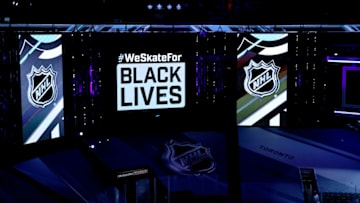 Moment of silence before Boston Bruins and Tampa Bay Lightning (Photo by Elsa/Getty Images)